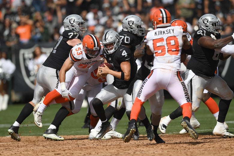 OAKLAND, CA - SEPTEMBER 30: Joe Schobert #53 of the Cleveland Browns sacks quarterback Derek Carr #4 of the Oakland Raiders during the second quarter of their NFL football game at Oakland-Alameda County Coliseum on September 30, 2018 in Oakland, California. (Photo by Thearon W. Henderson/Getty Images)